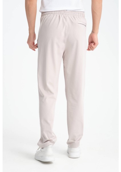 Erkek Gri Rahat Kesim Düz Paça Dalgıç Kumaş Etiket Detaylı Eşofman Altı modelleri