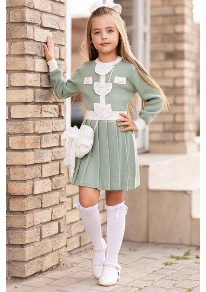 Kız Çocuk Beli Şerit ve Göğsü Fiyonk Detaylı Eteği Piliseli Yeşil Şifon Elbise fiyatları