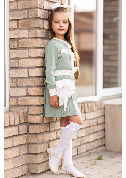 Kız Çocuk Beli Şerit ve Göğsü Fiyonk Detaylı Eteği Piliseli Yeşil Şifon Elbise modelleri