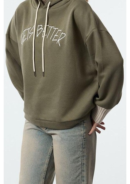 Tarz Relaxed Kapüşonlu Düşük Kol Uzun Kalın Içi Polarlı Triko Bant Detaylı Örme Sweatshirt fiyatları