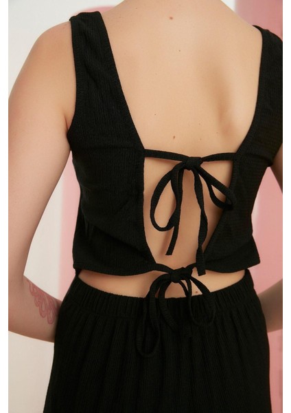 Kadın Moda Ispanyol Paça Kare Yaka Uzun Sırt Dekolteli Bağlama Detaylı Bürümcük Dokulu Örme Tulum fırsatları