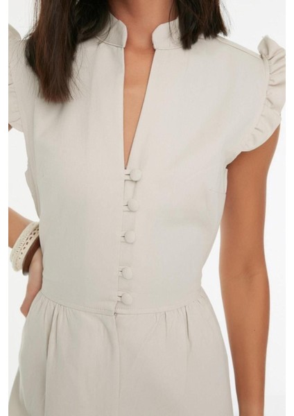 Kadın Moda Standart Kol Boru Paça Hakim Yaka Uzun Taş Fırfır ve Düğme Detaylı Uzun Dokuma Tulum modelleri