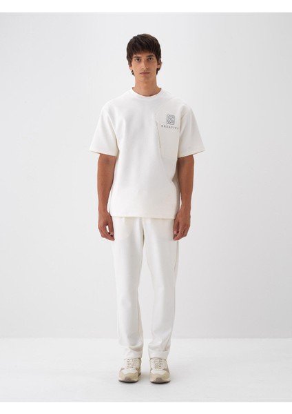 Erkek Ekru Pamuk Dokulu Regular Fit Jogger Pantolon fiyatları