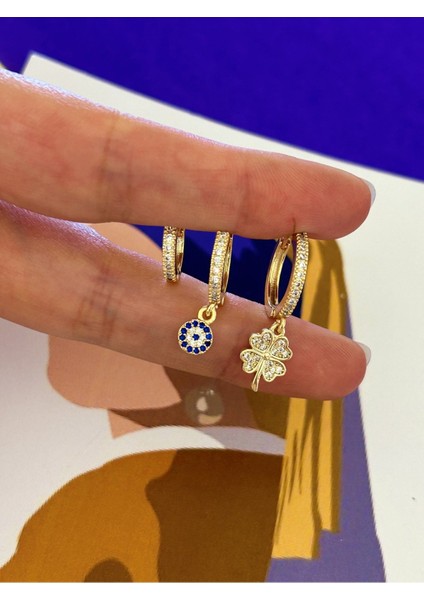 Gold Renk Çelik Zirkon Taşlı Yonca ve Nazarlıklı Sallantılı Boy Boy Sıralı Üçlü Halka Küpe fiyatları