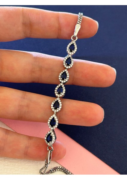 6,25 gr Silver Renk Yedi Sıra Damla Lacivert-Beyaz Zirkon Taşlı 925 Gümüş Bileklik modelleri