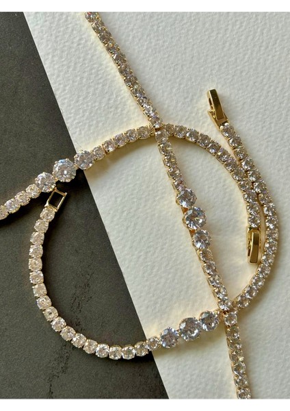 Gold Renk Yuvarlak Kesim Sıralı Zirkon Taşlı Bileklik modelleri