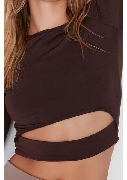 Kadın Crop Bisiklet Yaka Fitted Kalıp Örme Pencere Cut Out ve Baş Parmak Delik Detaylı Spor Üst Bluz fiyatları