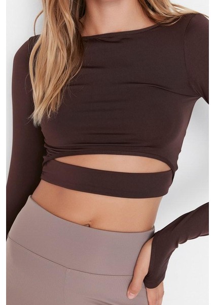 Kadın Crop Bisiklet Yaka Fitted Kalıp Örme Pencere Cut Out ve Baş Parmak Delik Detaylı Spor Üst Bluz fırsatları