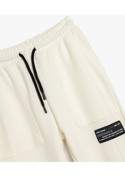 Jogger Eşofman Altı Cepli Beli Bağlamalı Aplike Detaylı modelleri