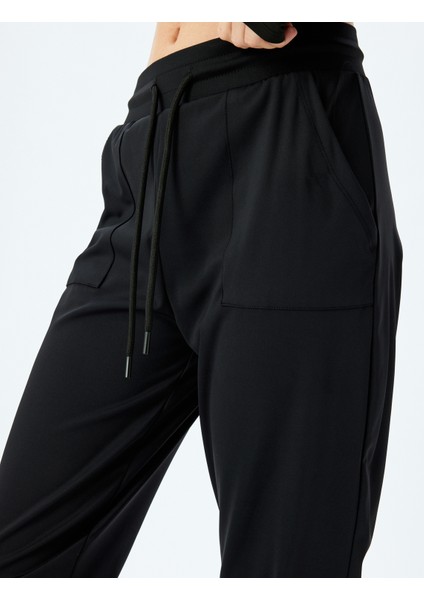 Cep Detaylı Yüksek Bel Bağcıklı Yumuşak Tuşe Jogger Spor Eşofman Altı Interlok indirimleri