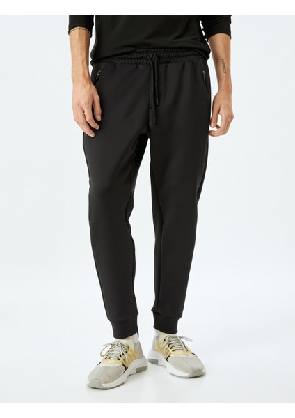 Beli Bağcıklı Fermuarlı Cep Detaylı Scuba Kumaş Jogger Spor Eşofman Altı