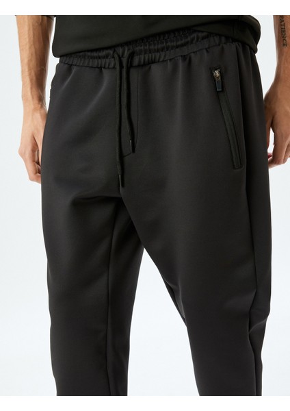 Beli Bağcıklı Fermuarlı Cep Detaylı Scuba Kumaş Jogger Spor Eşofman Altı