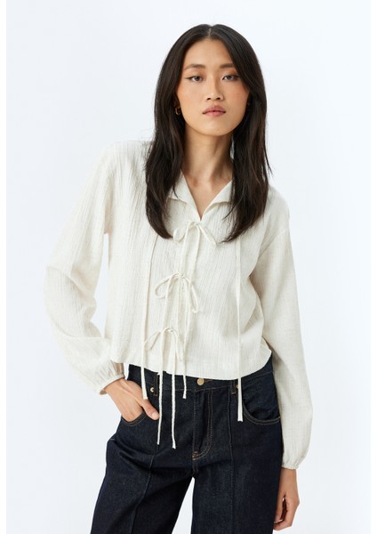 Rahat Kalıp Viskon Keten Karışımlı Uzun Kollu Dokulu Fiyonk Bağlama Detaylı Bluz fiyatları