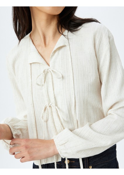Rahat Kalıp Viskon Keten Karışımlı Uzun Kollu Dokulu Fiyonk Bağlama Detaylı Bluz indirimleri