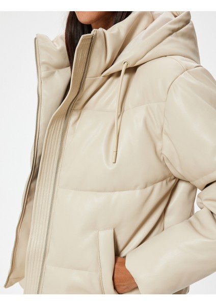 Şişme Mont Deri Görünümlü Kapüşonlu Fermuarlı Cep Detaylı indirimleri