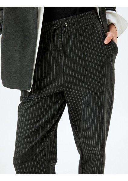 Beli Lastikli Bağlamalı Çizgili Havuç Kesim Kumaş Pantolon indirimleri