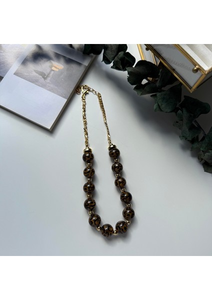Gold Detaylı Kahverengi Top Leopar Kolye
