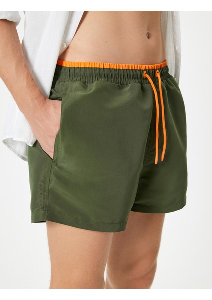 Kısa Deniz Şortu File Astarlı Beli Bağlamalı Cepli Rahat Kalıp indirimleri