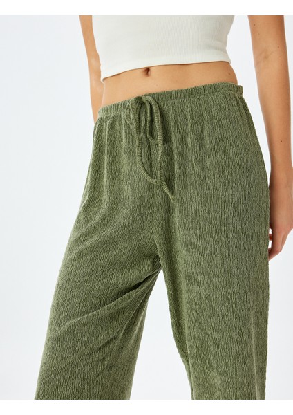 Beli Bağlamalı Dokulu Bol Paça Pantolon