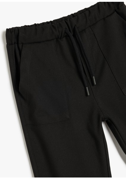 Standart Bel Cepli Düğme Detaylı Basic Jogger Pantolon modelleri
