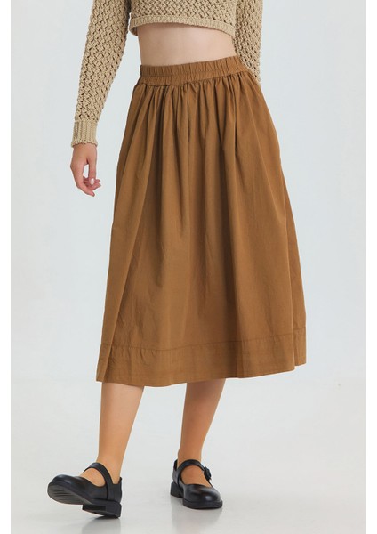 Beli Lastikli Hacimli Midi Boy Kloş Etek Taba fiyatları