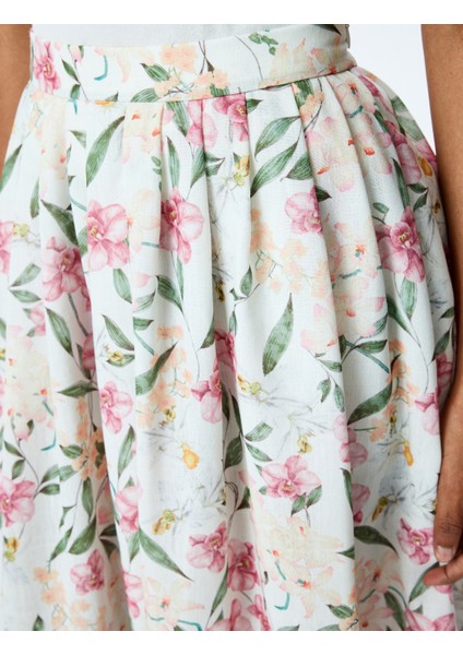 Yırtmaç Detaylı Cepli Yüksek Bel Uzun Kloş Çiçekli Etek indirimleri