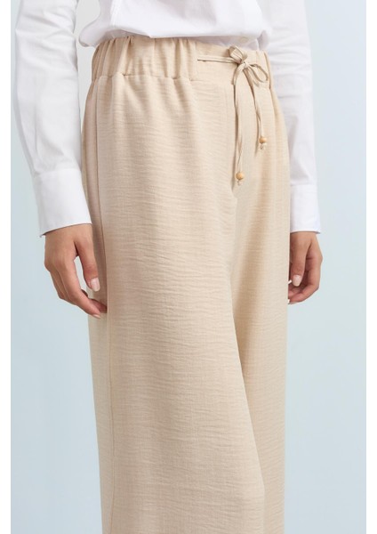 Parça Detaylı Bol Paça Pantolon Bej modelleri
