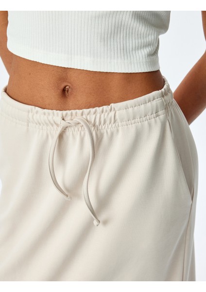 Modal Karışımlı Oversize Beli Bağcıklı Midi Etek indirimleri