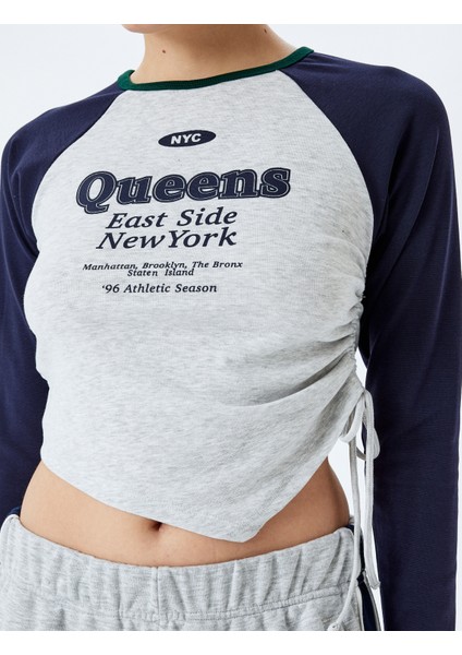 Uzun Reglan Kol Slim Fit Kolej Baskılı Büzgülü Asimetrik Crop Tişört indirimleri