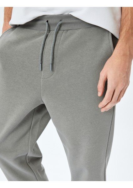 Regular Fit Cepli Şardonlu Pamuk Karışımlı Beli Bağcıklı Eşofman Altı indirimleri