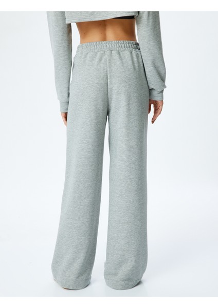 Asimetrik Bel Detaylı Nervürlü Geniş Paça Eşofman Altı fırsatları