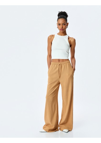 Beli Bağcıklı Dokulu Yüksek Bel Geniş Paça Pantolon