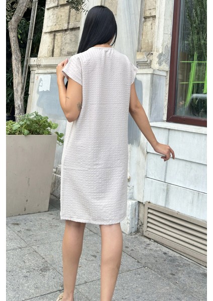 Bej Lotus Dokulu Cep Detaylı Midi Elbise modelleri