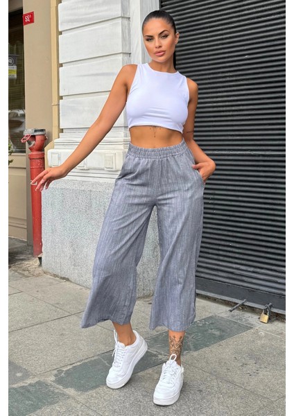 Kadın Siyah Lastikli Yüksek Bel, Cepli, Yırtmaçlı, Geniş Paça, Salaş Keten Kapri Pantolon fırsatları