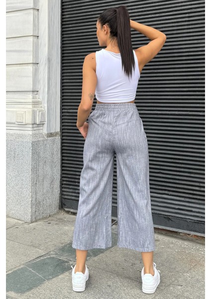 Kadın Siyah Lastikli Yüksek Bel, Cepli, Yırtmaçlı, Geniş Paça, Salaş Keten Kapri Pantolon indirimleri