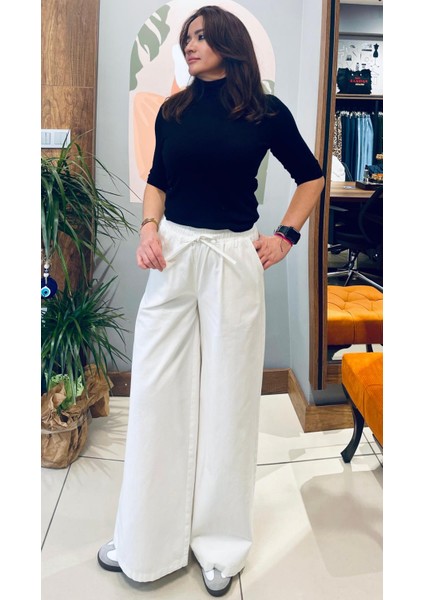 Beli Lastikli ve Bağcıklı Pantolon.