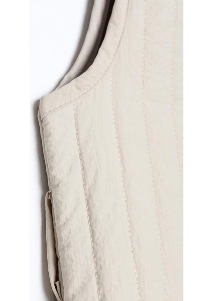 Bej-Oversize Çıtçıtlı Dikey Çizgi Uzun Kapitone Yelek fırsatları