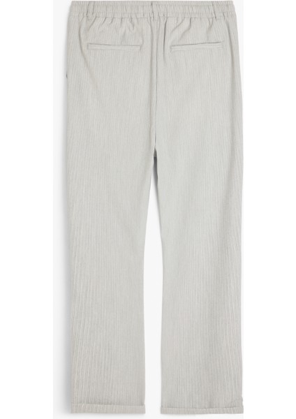 Katlamalı Paça Viskon Karışımlı Düğmeli Beli Bağcıklı Slim Fit Pantolon fiyatları