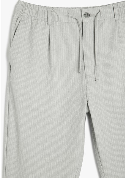 Katlamalı Paça Viskon Karışımlı Düğmeli Beli Bağcıklı Slim Fit Pantolon modelleri