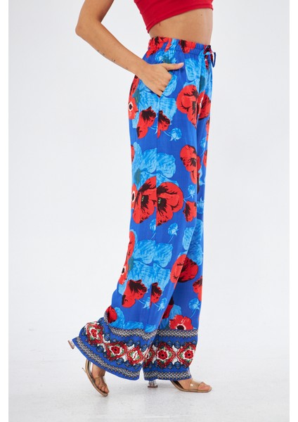 Kadın Kırmızı Çiçek Baskılı Paça Detaylı ve Dökümlü Yandan Cepli Palazzo Pantolon modelleri