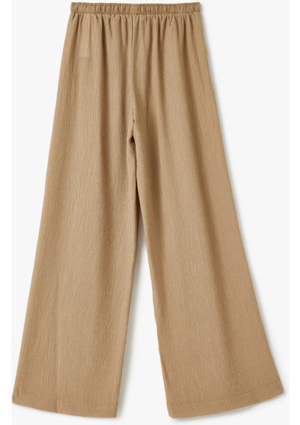 Beli Bağcıklı Geniş Paça Cepli Viskon Karışımlı Pantolon fırsatları