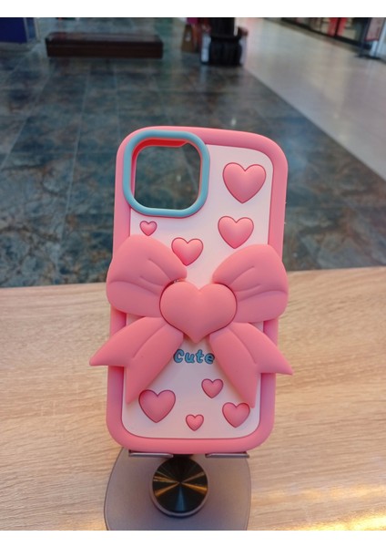iPhone 15 Uyumlu Pembe Renk Kurdele Tasarım Kılıf Kurdelesi Stand Olabilen Yumuşak Dokulu Kapak