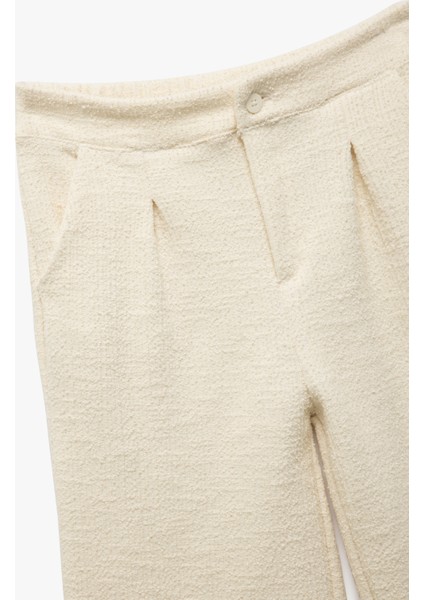 Cepli Pile Detaylı Düğmeli Bol Paça Tüvit Pantolon modelleri