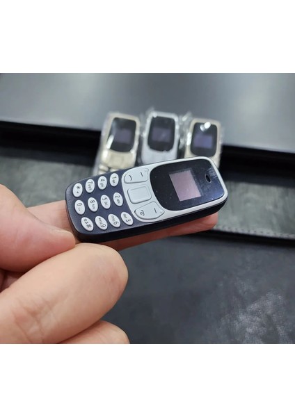 Parmak Tuşlu Cep Telefonu (Çift Sim Kartlı, Ses Değiştirme Özelliği) Dünyanın En Küçük Telefonu