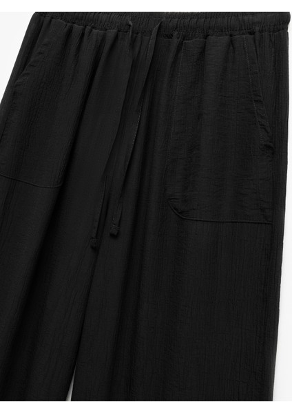 Beli Bağcıklı Geniş Paça Cepli Viskon Karışımlı Pantolon modelleri