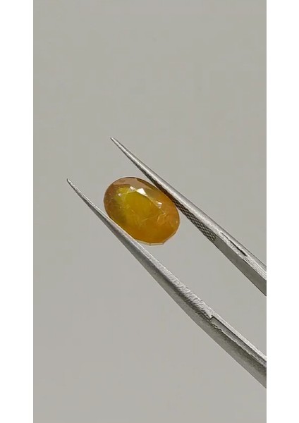 4.25 ct 10X6.7 mm Oval Natural Yellow Sapphire ( Heated Glass Filling)