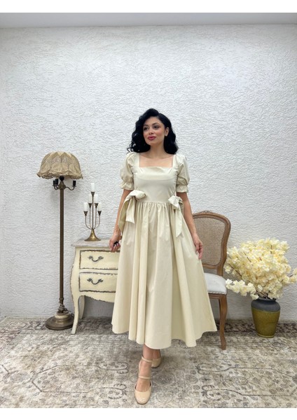 Bej Fiyonklu Kare Yaka Kloş Poplin Elbise fiyatları