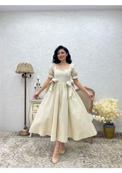 Bej Fiyonklu Kare Yaka Kloş Poplin Elbise modelleri