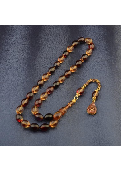 Burhan sağlam Özel Seri Arpa Kesim Gümüş Püsküllü 12x9 mm Ateş Kehribar Tesbih fiyatları