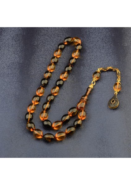 Burhan sağlam Özel Seri Arpa Kesim Gümüş Püsküllü 12x9 mm Ateş Kehribar Tesbih fiyatları